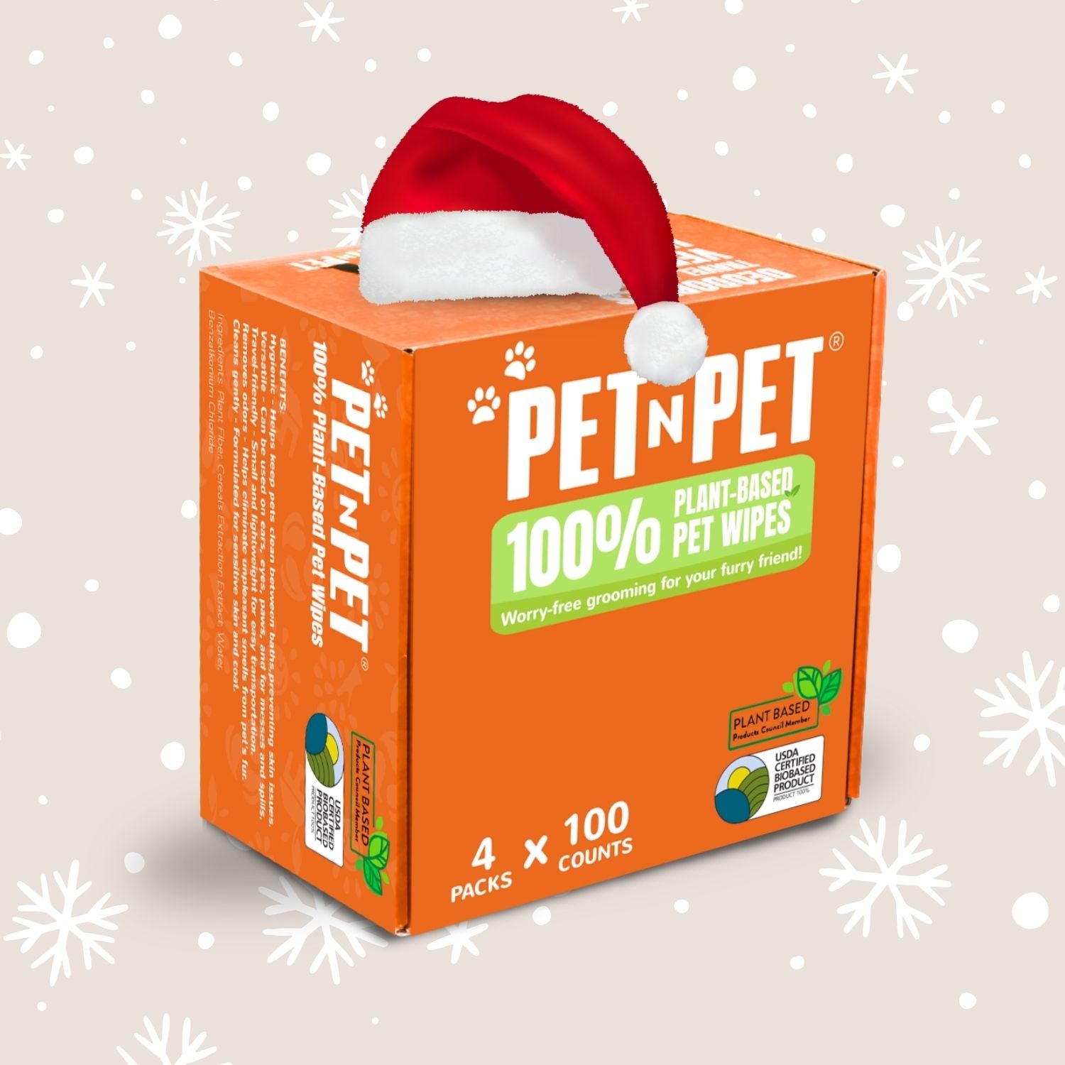 Box of Pet 'N Pet plant-based pet wipes with a Santa hat on a snowy background
