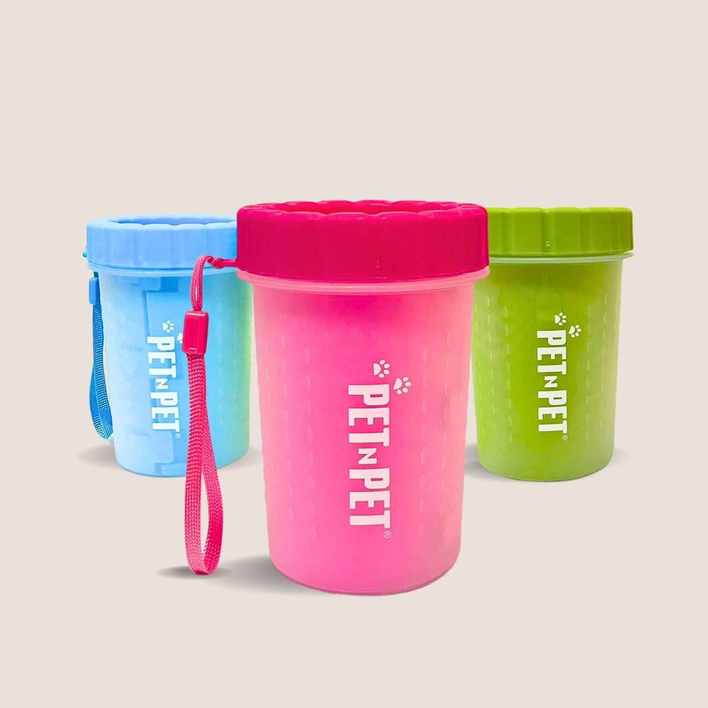 Three colorful pet paw cleaner with 'PET N PET' branding on a beige background