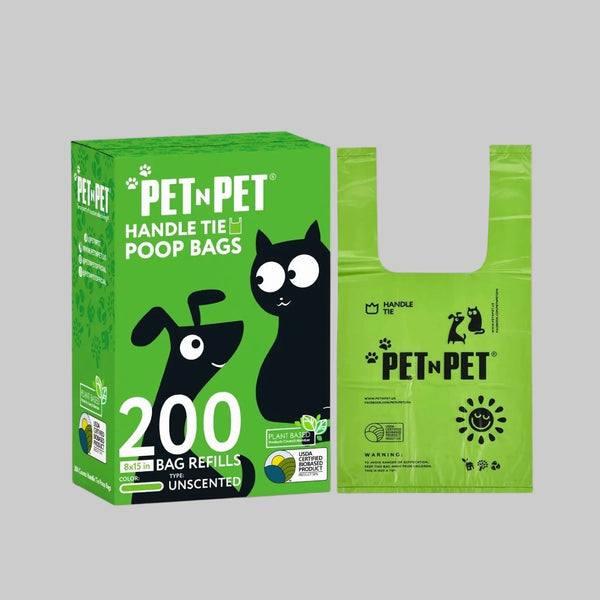 Green box of PET N PET handle tie poop bags with a green bag on a beige background
