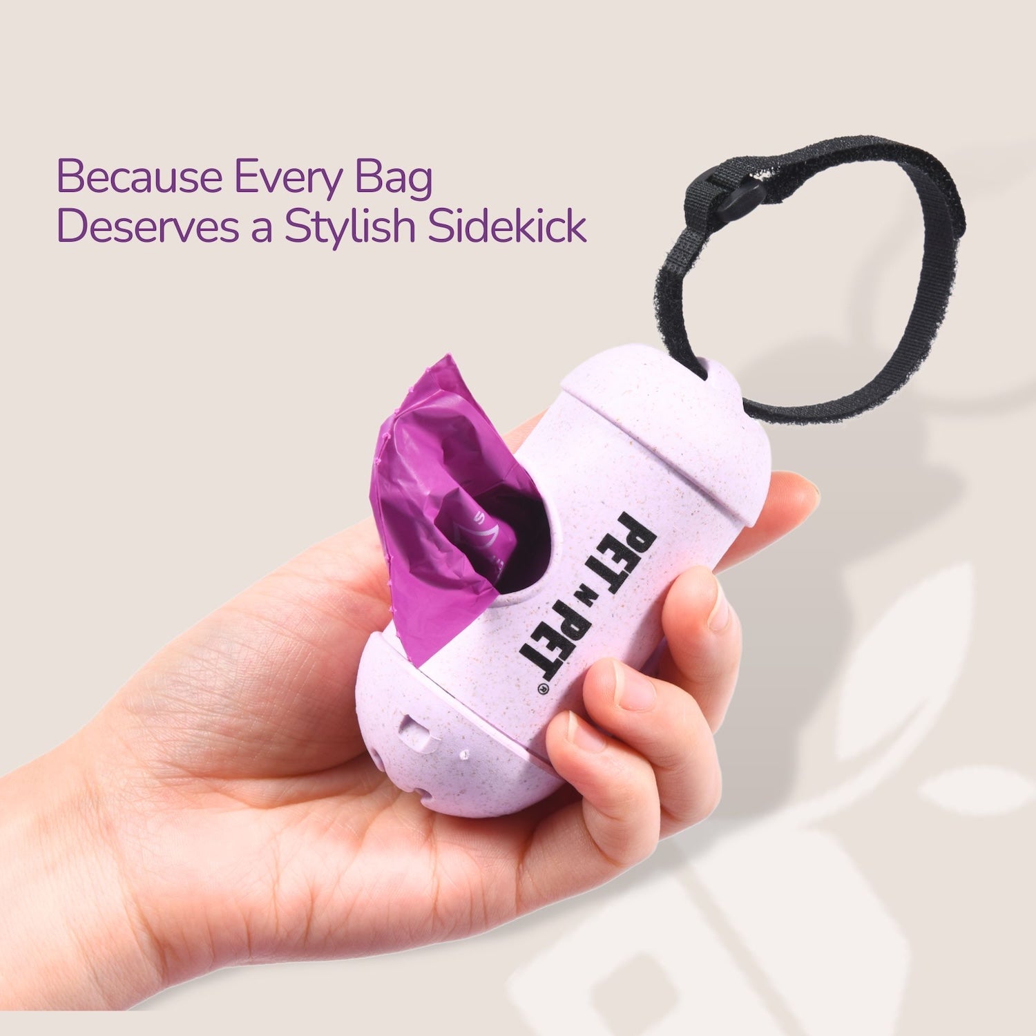 Hand holding a purple and white pet waste bag dispenser with text 'Because Every Bag Deserves a Stylish Sidekick'.