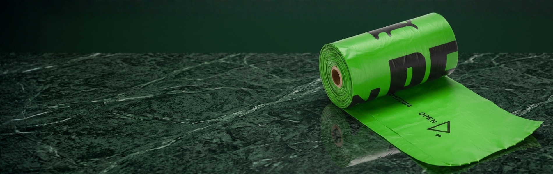 Green roll of paper with black text on a dark textured surface
