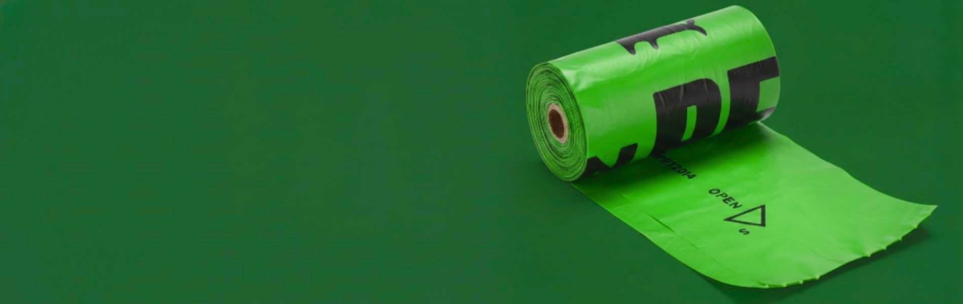 Green roll of paper with a logo on a green background